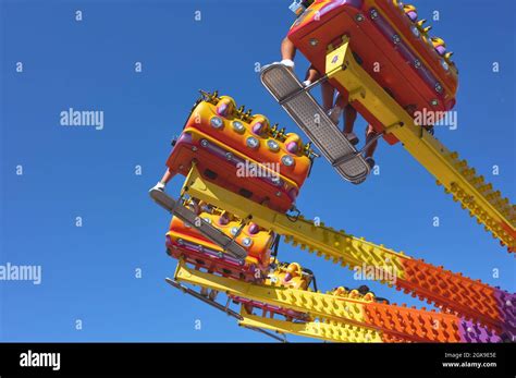 Detail Of People Riding On A Carousel In An Amusement Park Stock Photo