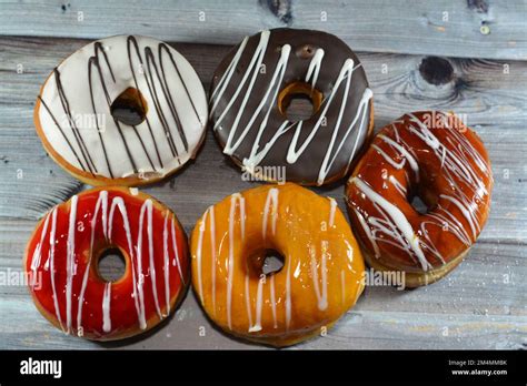 Ring Donuts With Brown And White Chocolate And Caramel Strawberry And