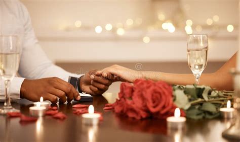 Love Engagement And Couple Holding Hands With Wedding Ring At