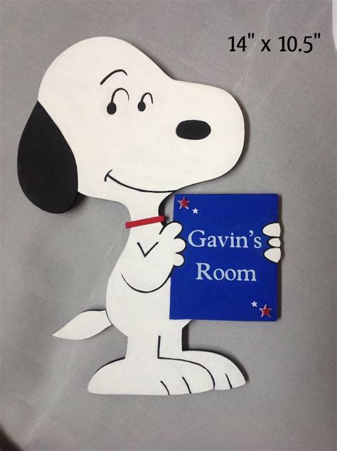 a cardboard cutout of a cartoon dog holding a sign that says, gavin's room