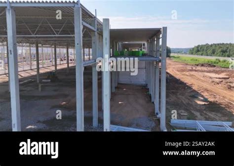 A construction site featuring a partially built structure with concrete ...