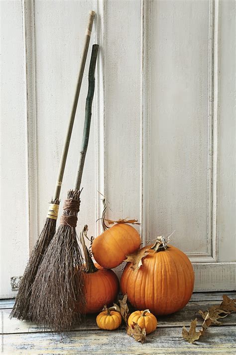 Brooms And Pumpkins In Front Of Door By Stocksy Contributor Sandra