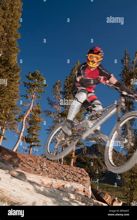 Man Mountain Biking And Catching Air Stock Photo Alamy