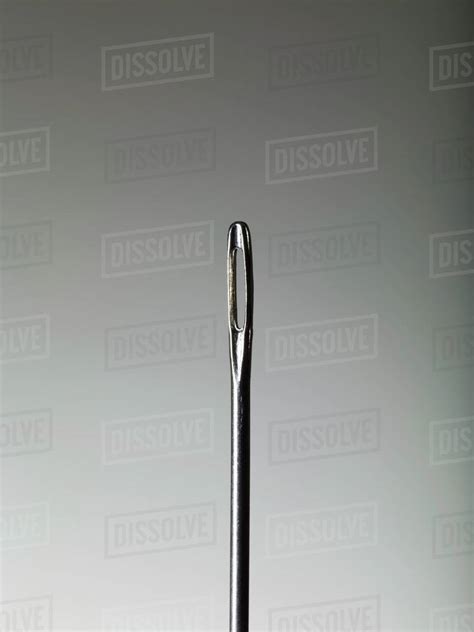 sewing needle close  royalty  stock photo dissolve