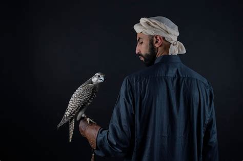 Premium Photo Young Arab Prince Holding A Bird Of Prey