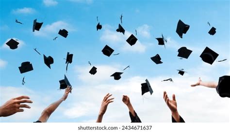 Graduating Students Hands Throwing Graduation Caps Stock Photo ...