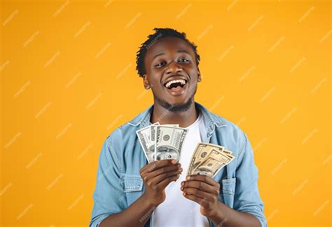 Premium Photo | Photo portrait of young people holding cash money with ...