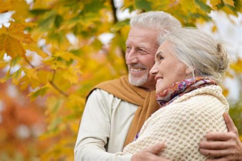 Premium Photo Portrait Of Beautiful Senior Couple Hugging In The Park