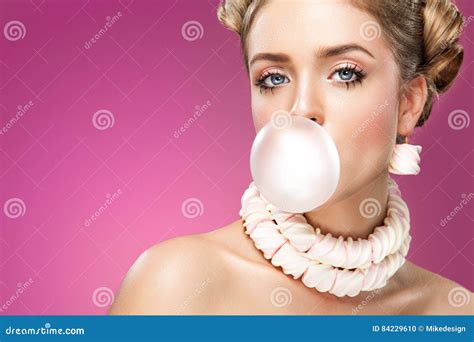 Beautiful Blonde Woman Blowing Pink Bubble Gum Fashion Portrait Stock