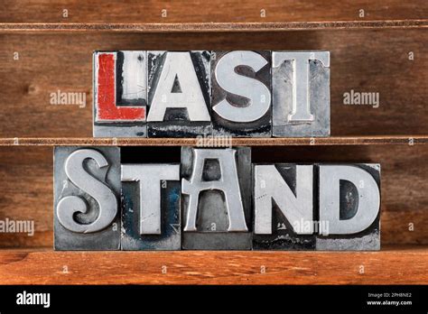 Last Stand Phrase Made From Metallic Letterpress Type On Wooden Tray