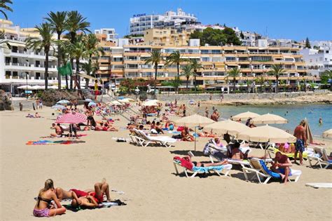 Sunbathers In Ses Figueretes Beach In Ibiza Town Spain Editorial Stock