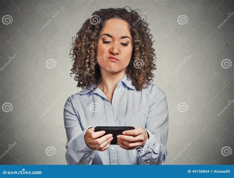 Woman Unhappy Annoyed By Someone On Her Cell Phone While Texting Stock