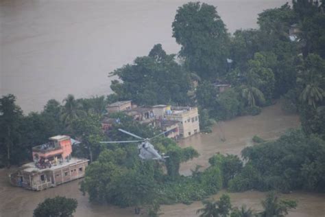 India Air Force Helicopters Rescue Dozens From Rooftops In West