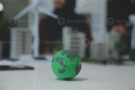 Business people having consultation about wind energy at company office