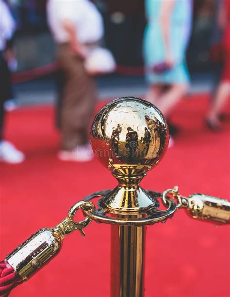 Red Carpet With Ropes And Golden Barriers On A Luxury Party Entrance