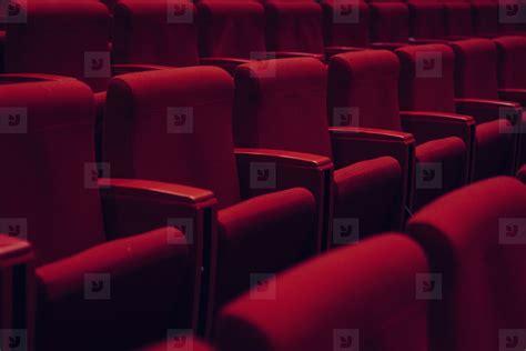 Red theater seats in a row 01 stock photo (180369) - YouWorkForThem