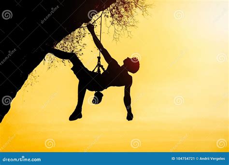 Silhouette Of Man Climbing At Sunset The Rock Climber During Rock