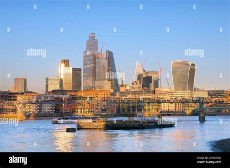 City of London skyline and Millennium Bridge seen from across the River ...