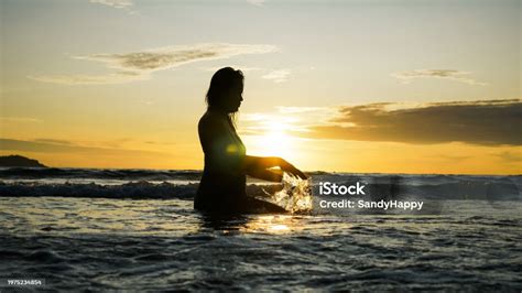 Silhouette Of Asian Woman Splash Water On Summer Vacation Holiday