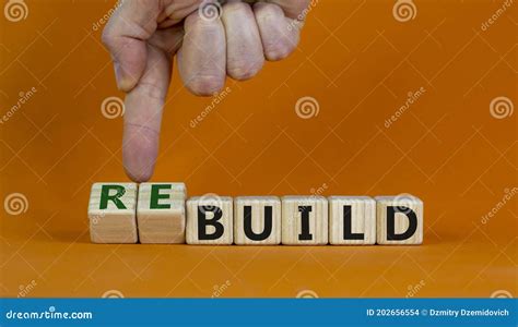 Time To Rebuild Concept Words `build` And `rebuild` On Cubes On A