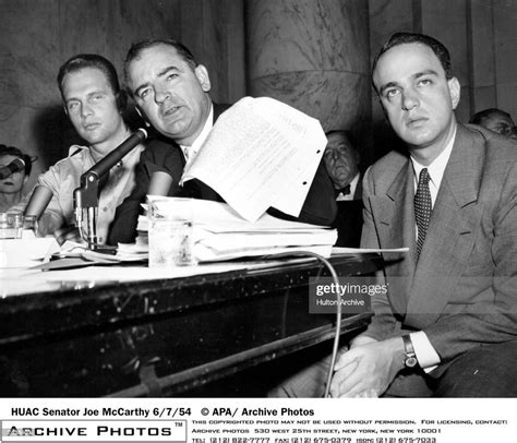 Senator Joe McCarthy is seen here waving a transcript of a monitored ...