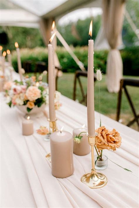 Candles Are Lined Up On A Long Table