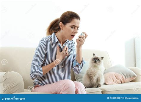 Woman Using Asthma Inhaler Near Cat Stock Image - Image of inhaler ...