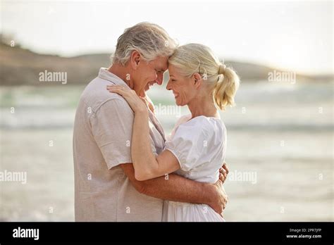 Closeup Of A Happy Senior Caucasian Couple Standing And Embracing Each Other On A Day Out At The