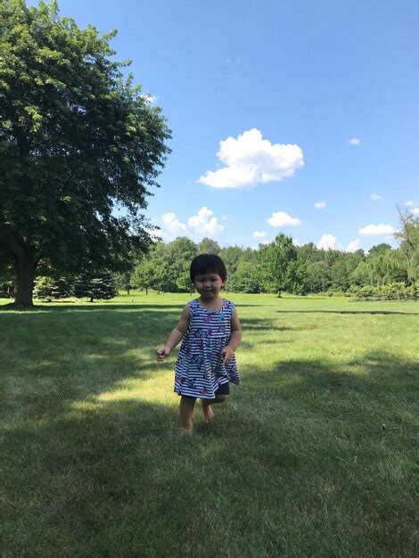 Premium Photo Full Length Of Girl On Field Against Sky