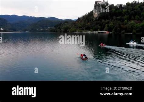 A shot from a drone of a rowing competition. Bled Castle. Drone view of ...