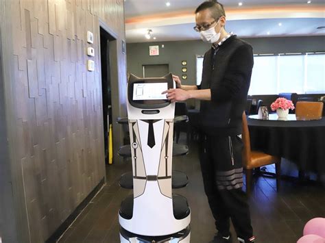 Meet The Singing Robotic Cat Serving Up Dumplings And Fried Rice In New