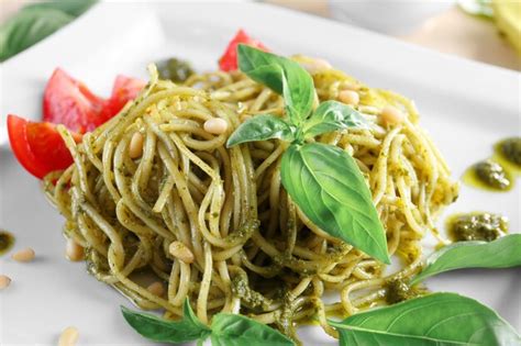 Premium Photo Delicious Pasta With Pesto Sauce On Plate Closeup