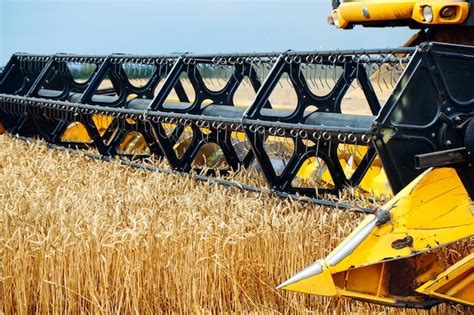 Premium Photo Combine Harvester Harvests Ripe Wheat Agriculture