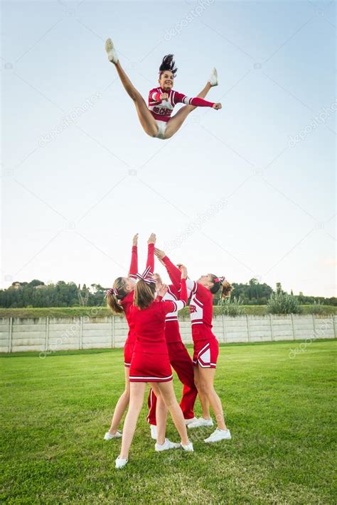 Group of Cheerleaders Performing Stunts Stock Photo by ©william87 34957623