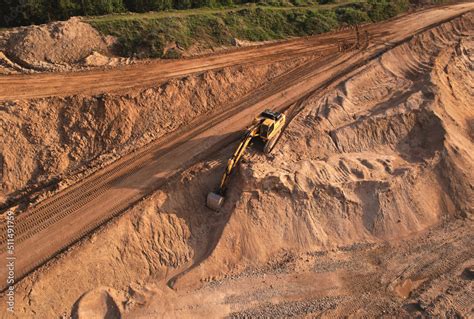 Excavator Dig Ground At Construction Site Earthmover On Road