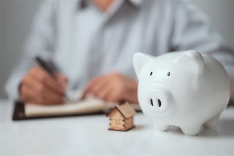 Premium Photo Concept Of Save Piggy Bank With Man Doing Finances And