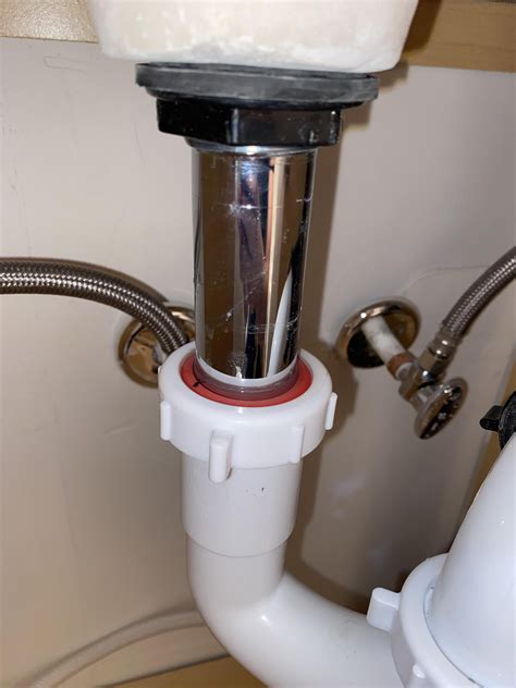 Leak under bathroom sink. Water seems to be pooling by the orange ring