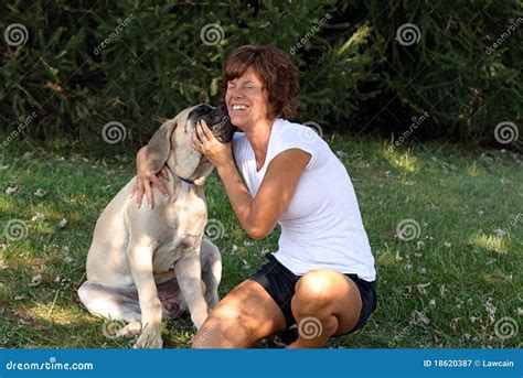 Puppy Kisses stock image. Image of holding, ground, cuddle - 18620387