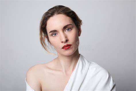 Beauty Portrait Of Young Woman With Red Lips Wearing White Clothing