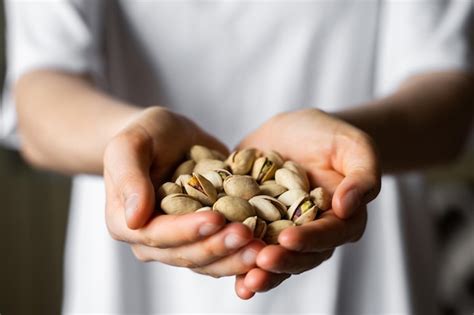 Premium Photo Pistachio In A Womans Hands Pistachio Nuts Is A Healthy