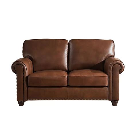 A Brown Leather Couch Sitting On Top Of A White Background