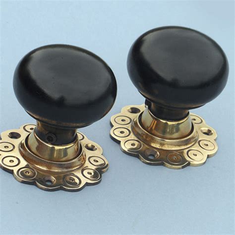 Ebony Bun Door Knobs With Brass Rose Ebony Wood Door Knobs