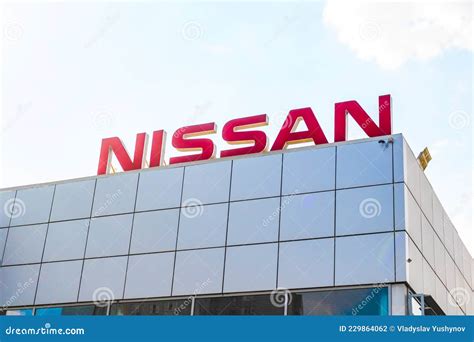 Japan Nissan Brand Logo on Blue Sky Background, Emblem, Symbol Close-up ...