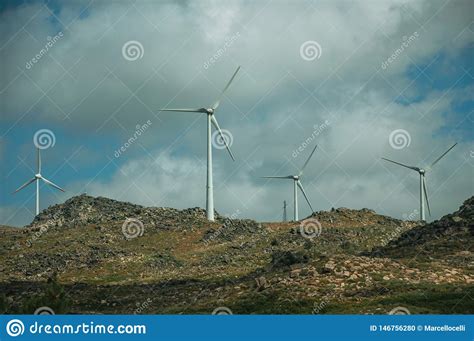 Wind Turbines For Electric Power Generation Over Hills Foto De Archivo