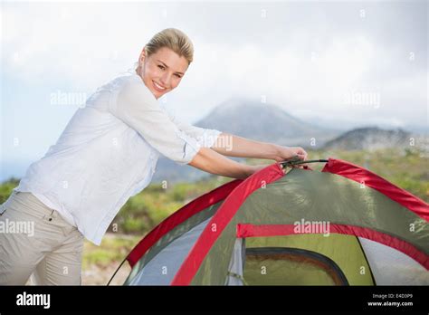Attractive Blonde Setting Up Her Tent Stock Photo Alamy