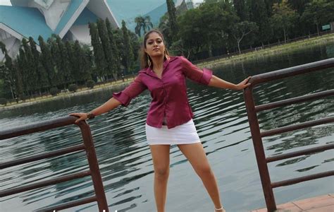 Spicy Photos Of Meghna Sunder Raj In Pink Yop And White Mini Skirt Exposing Her Hot Thighs
