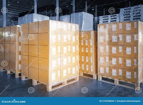 Stacked Of Package Boxes Wrapped Plastic Flim On Plastic Pallets At