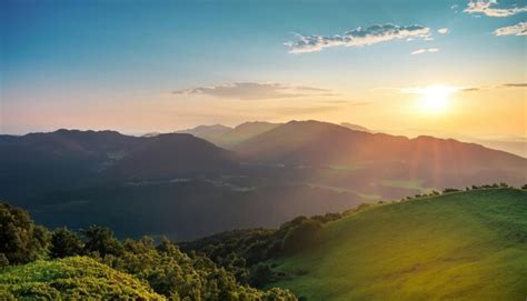 Premium Photo | 535_beautiful sunrise over the green mountain