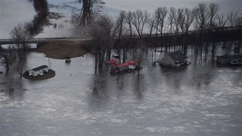 Homes flood as Missouri River overtops, breaches levees