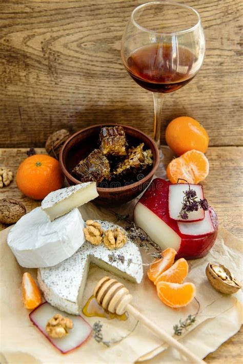 Rustic Cheese Platter With Camembert Brie Gouda On Wooden Table Stock